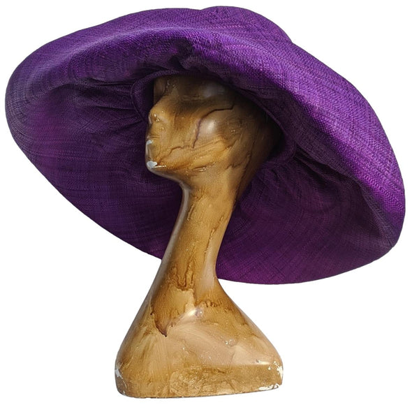 Purple raffia hat by Soava. Oversized shapeable brim raffia hat.
